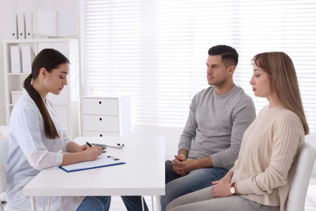 Walk in STD testing in Shenandoah: Doctor consults with couple.