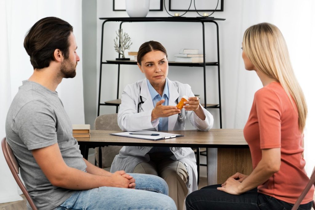 Same day STI test Houston: Doctor in white coat discussing results with patient in a bright clinic, offering rapid STI testing services.