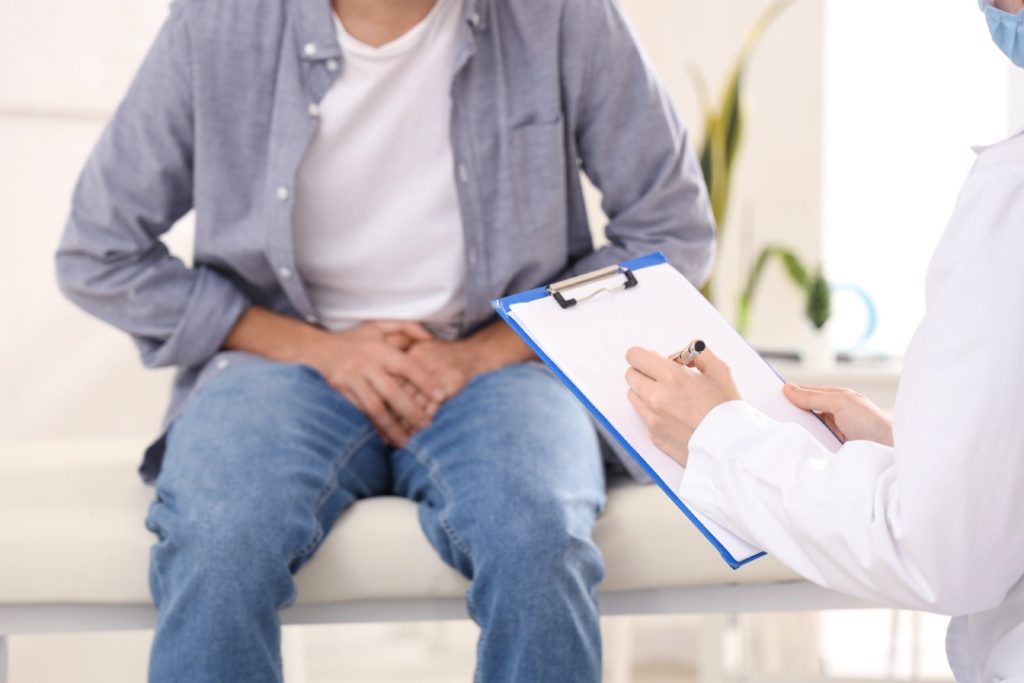 Patient showing symptoms during exam—affordable and discreet care available through cheap STI testing Houston providers.