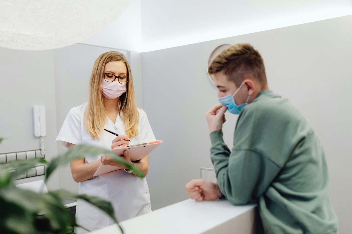 Patient checking in for confidential Walk In STD Testing Houston services.