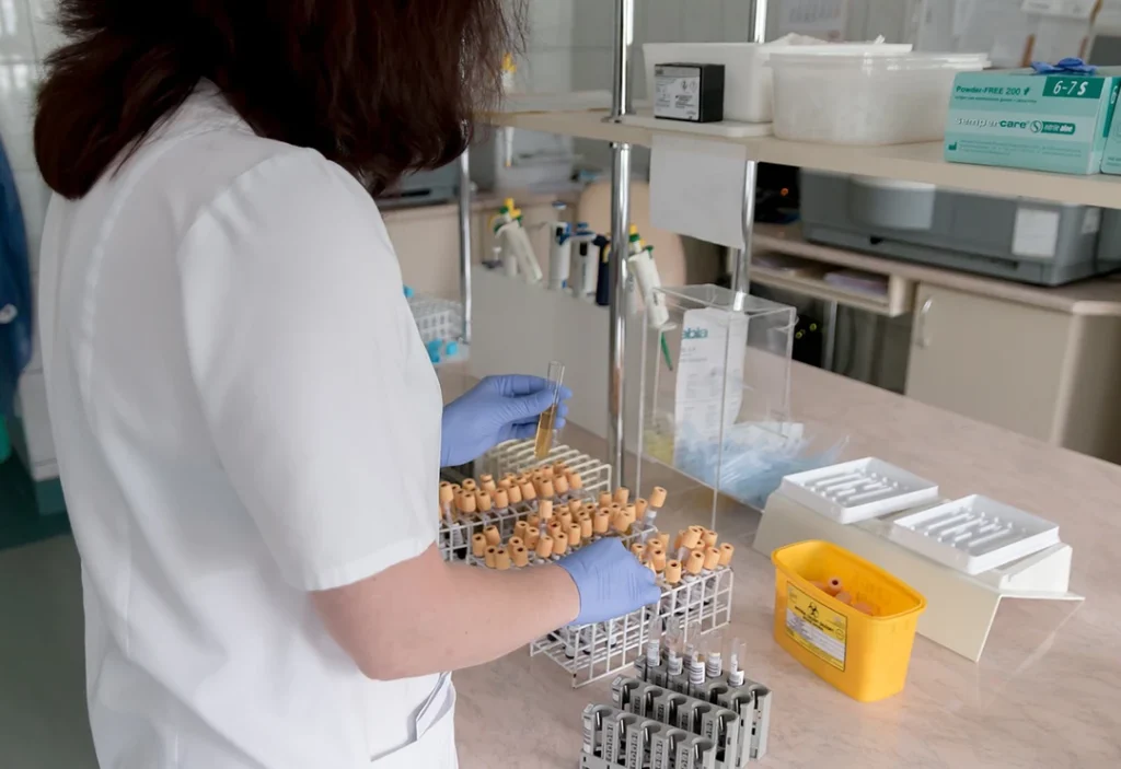 Lab technician preparing test tubes for fast, confidential, and affordable std testing Houston TX results.