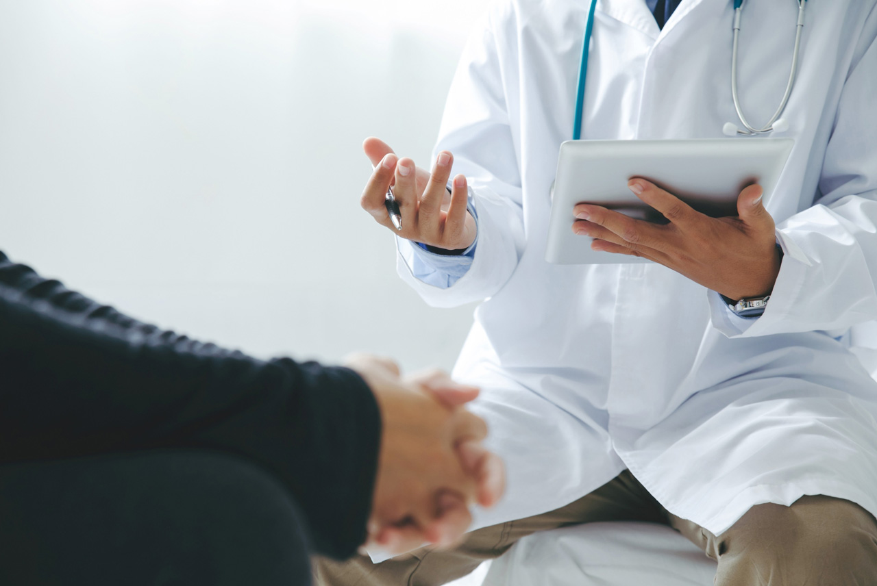 Medical professional discussing lab options for cheap STI testing Houston services in a modern clinic setting.