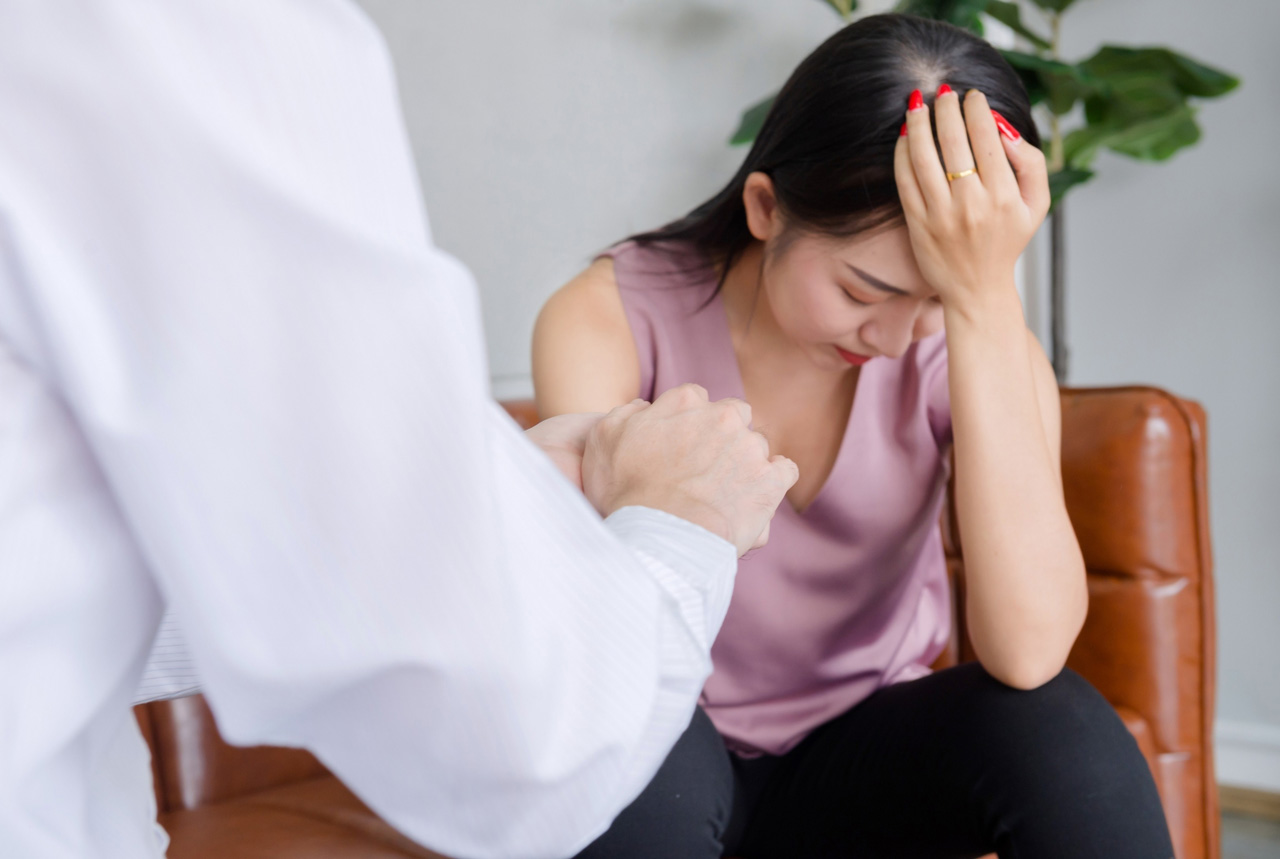 A healthcare provider offering comfort and support to an anxious patient during a same day STI test Houston clinic visit.
