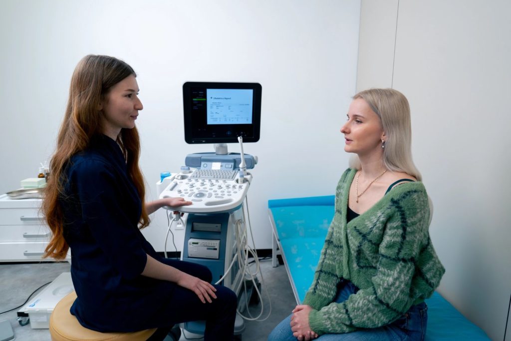 A medical professional discussing diagnostic results with a patient at an affordable STD testing clinic in Houston.