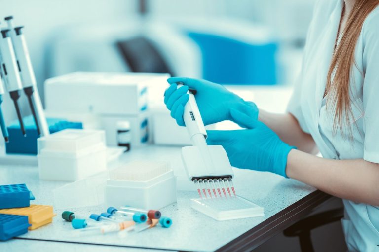 Medical professional in a laboratory processing confidential results for cheap std testing houston health centers.