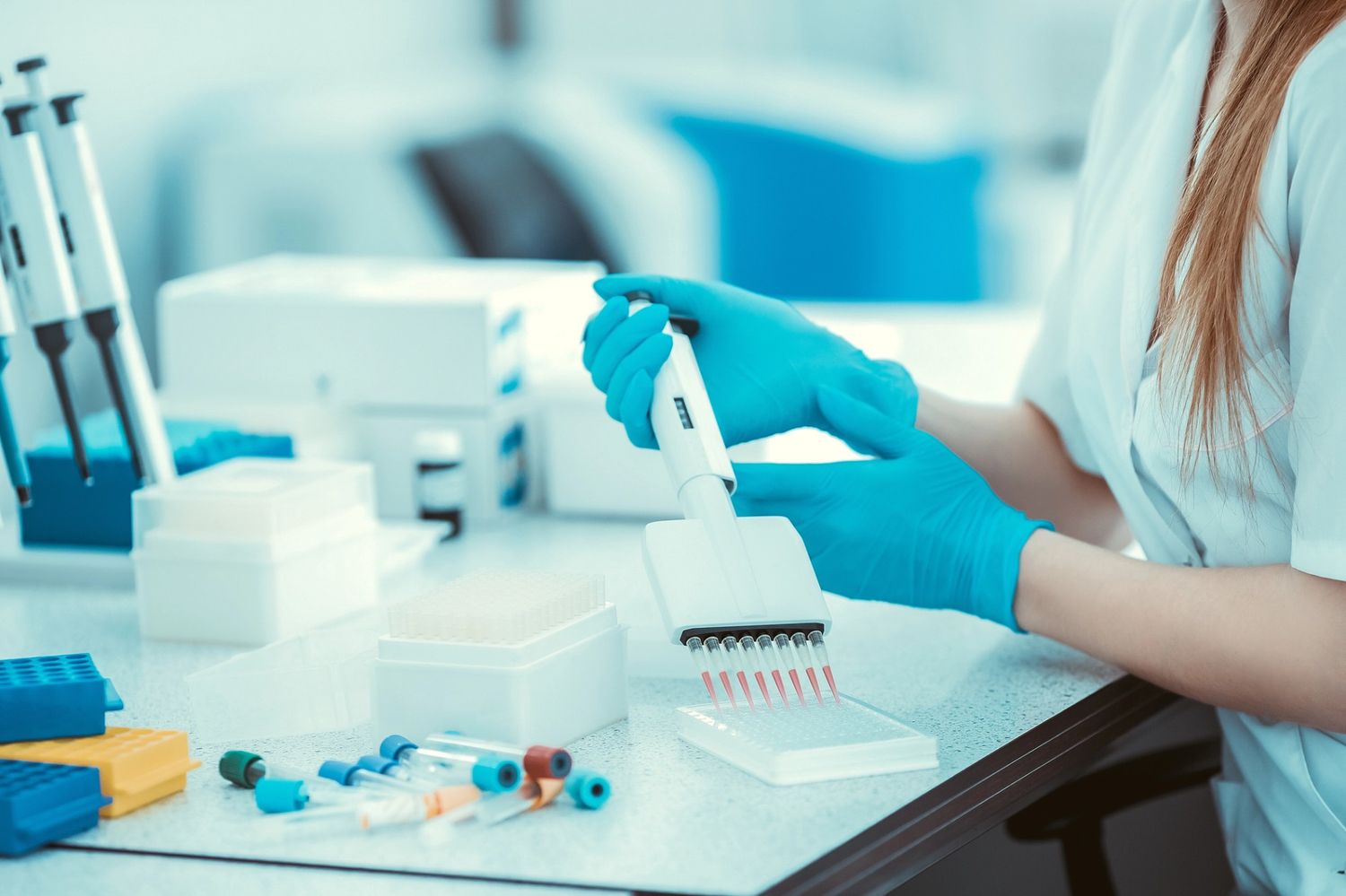 Medical professional in a laboratory processing confidential results for cheap std testing houston health centers.