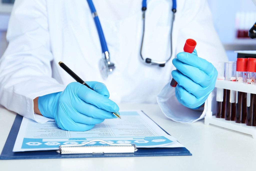 Doctor reviewing lab results for confidential STD testing Houston, ensuring accurate and private medical diagnosis.