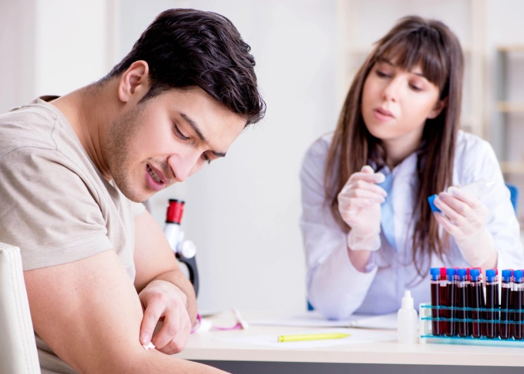 A male patient receives a consultation for professional STD testing Houston at a local medical clinic office.