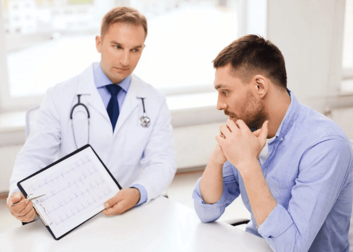 Medical professional reviewing test charts with a patient during a consultation for std testing houston results.